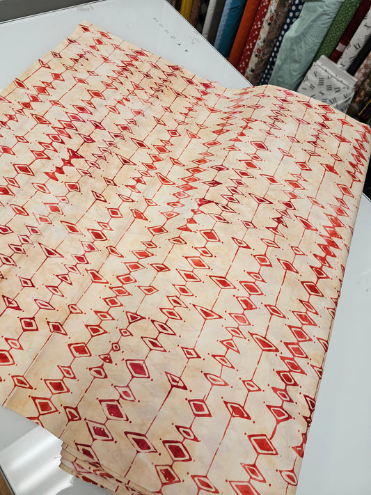 Anthology Batik Argyle in Ruby with Tan Background
