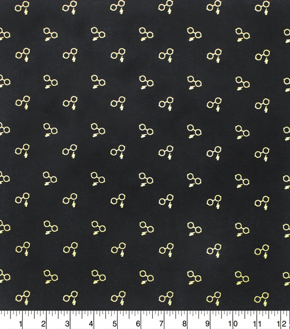 $5/yard $45/Bolt Licensed Harry Potter Glasses & Bolt Gold Metallic on Black 23800189LJAS